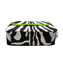 An angled side profile view of the closed 'Green Zebra' leather jewelry case resting flat, highlighting the seamless alignment of the vibrant neon green and black zebra pattern across the firm perimeter corners, clean black edge glazing, and a robust structural base build.