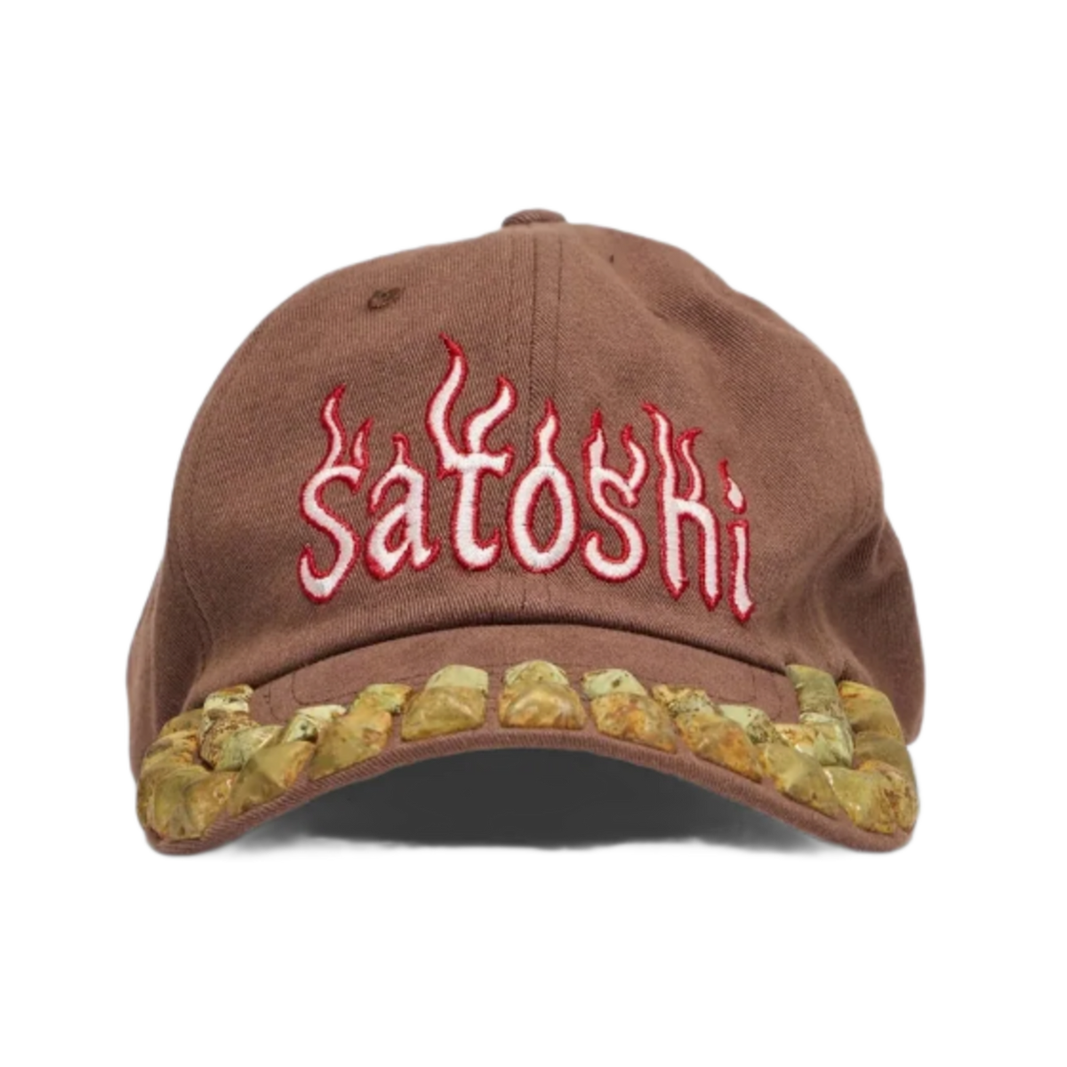 Front view of the Satoshi Nakamoto hat in a washed brown cotton canvas, featuring pink embroidered 'Satoshi' text across the crown and a dense cluster of multi-sized brass and silver metal studs arranged across the brim to form a flame pattern.