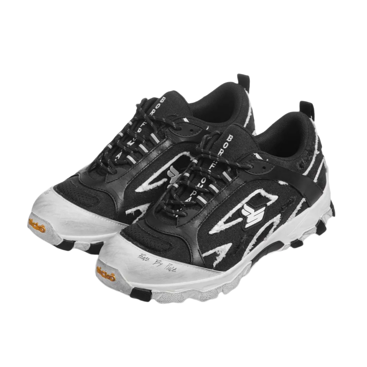 A three-quarter lateral angled layout view of both Sicko Vessel hiking shoes arranged together, emphasizing the aggressive geometric shapes of the high-contrast black and white leather side cages, the thick protective white toe caps, the intricate performance lacing matrix, and the multi-textured durability of the trail design.