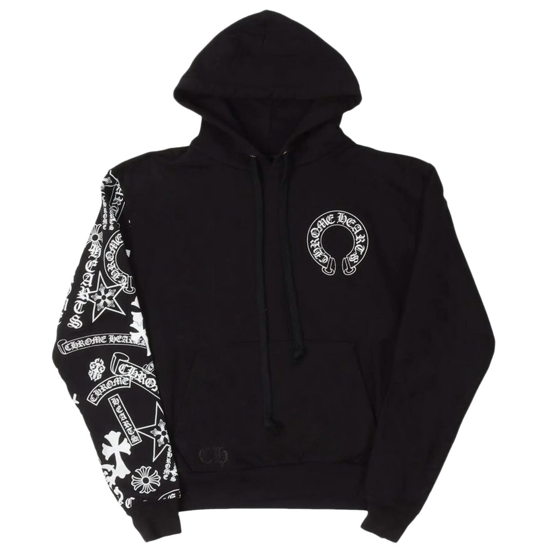 Front flat lay view of the Chrome Hearts 'Stencil Sleeve' hoodie in heavy black fleece, featuring an oversized drawstring hood, a white circular horseshoe monogram logo printed on the left chest, a split kangaroo pouch pocket, and a dense white stenciled cluster of signature gothic cross and scroll branding graphics running down the length of the right sleeve.