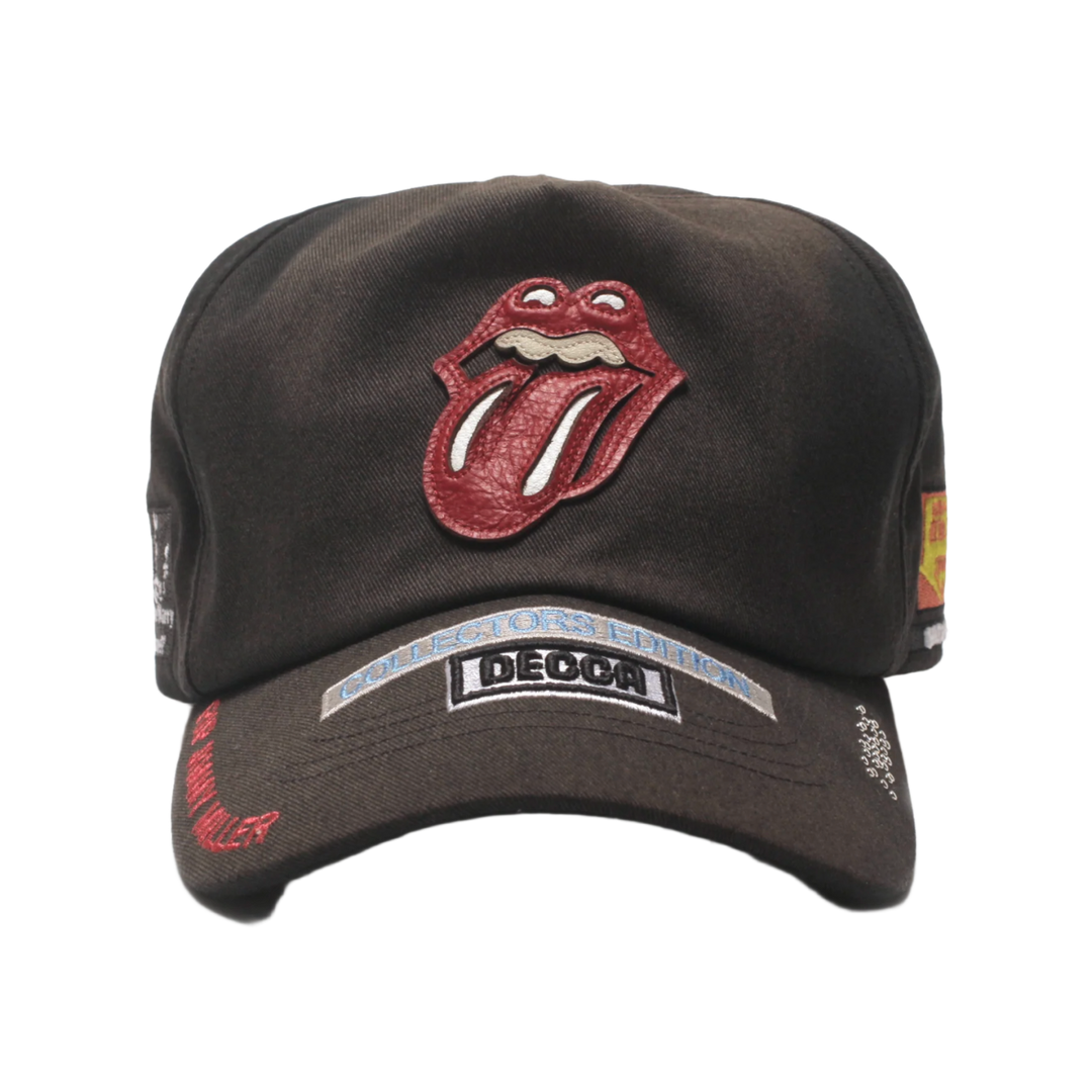 Front view of the Paly Hollywood 'Rolling Stones' cap in a vintage-washed black cotton canvas, featuring the iconic red and white Rolling Stones tongue-and-lips logo embroidered on the front, complemented by a stitched black and white 'BEGGARS BANQUET' album patch on the brim.