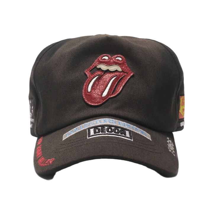 Front view of the Paly Hollywood 'Rolling Stones' cap in a vintage-washed black cotton canvas, featuring the iconic red and white Rolling Stones tongue-and-lips logo embroidered on the front, complemented by a stitched black and white 'BEGGARS BANQUET' album patch on the brim.
