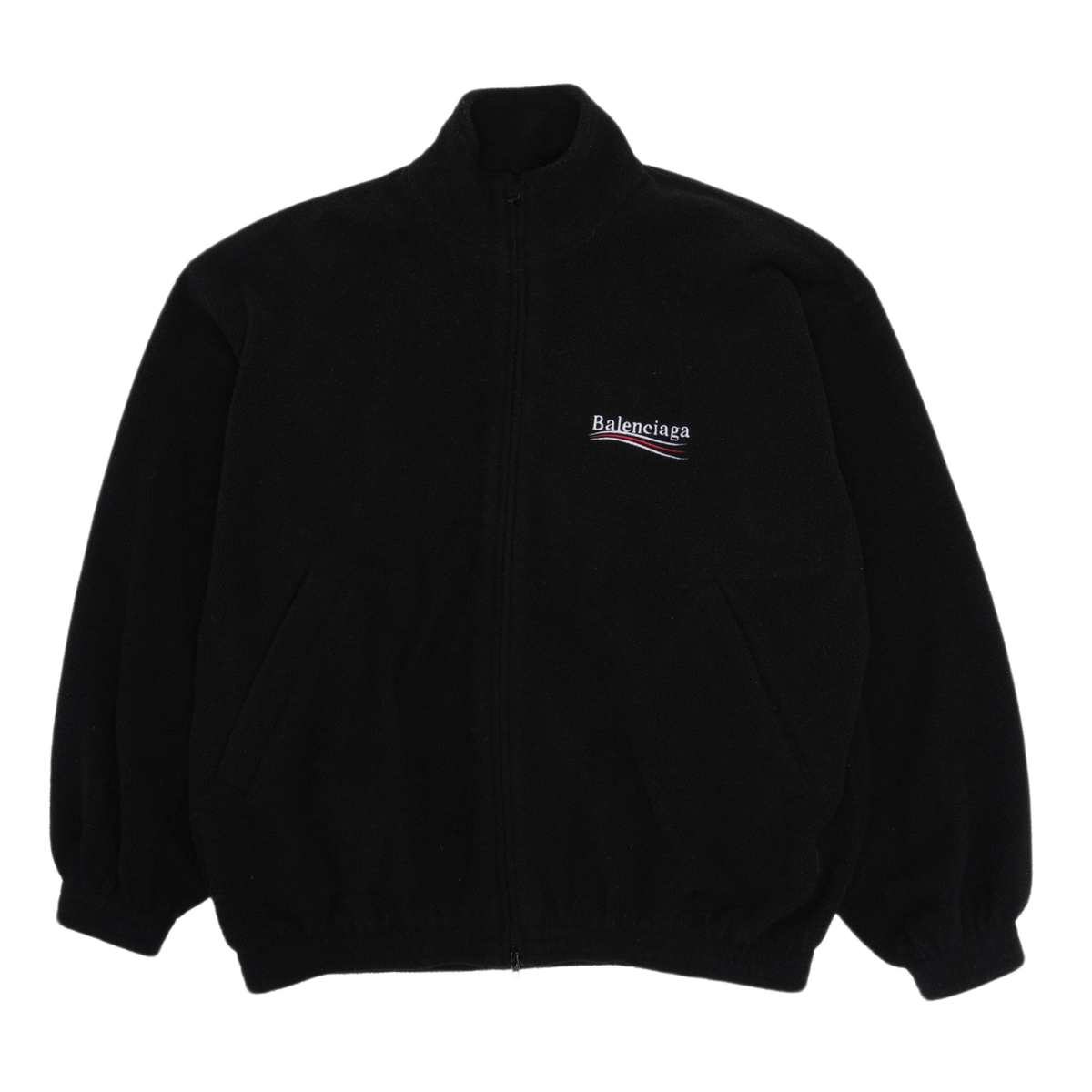 Front flat lay view of the Balenciaga fleece jacket in a premium heavyweight plush jet-black polar fleece, showcasing a heavily padded oversized streetwear silhouette, a high mock-neck collar, a full-length center zipper track hidden beneath a clean fabric placket, loose dropped shoulders, relaxed sleeves with gathered elastic cuffs, and a small embroidered corporate political campaign wave logo monogram stitched cleanly in red, white, and blue on the left chest.
