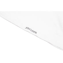 Close-up angled detail of the tank top's side trim and clean perimeter stitching against a white background, highlighting the uniform texture of the vintage ribbed cotton weave.