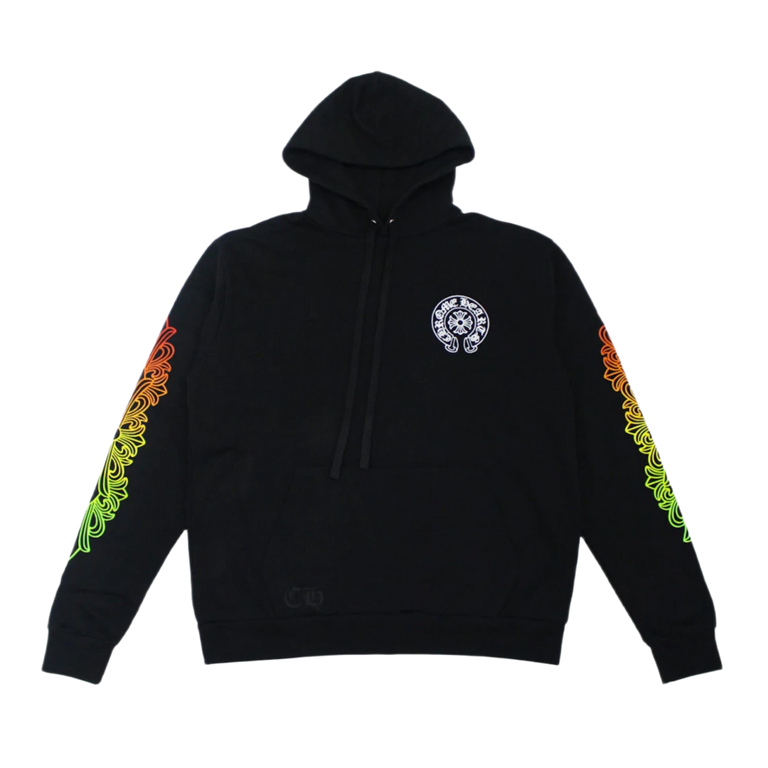Front flat lay view of the Chrome Hearts hoodie in a premium heavyweight jet-black cotton fleece, showcasing a relaxed boxy streetwear silhouette, a structured drawstringless crossover hood, a classic kangaroo pouch pocket, tight ribbed knit cuffs and hem, a small white signature horseshoe monogram printed cleanly on the left chest, and a bold, vibrant multi-colored rainbow gradient floral cross graphic pattern running down the outer length of both sleeves.