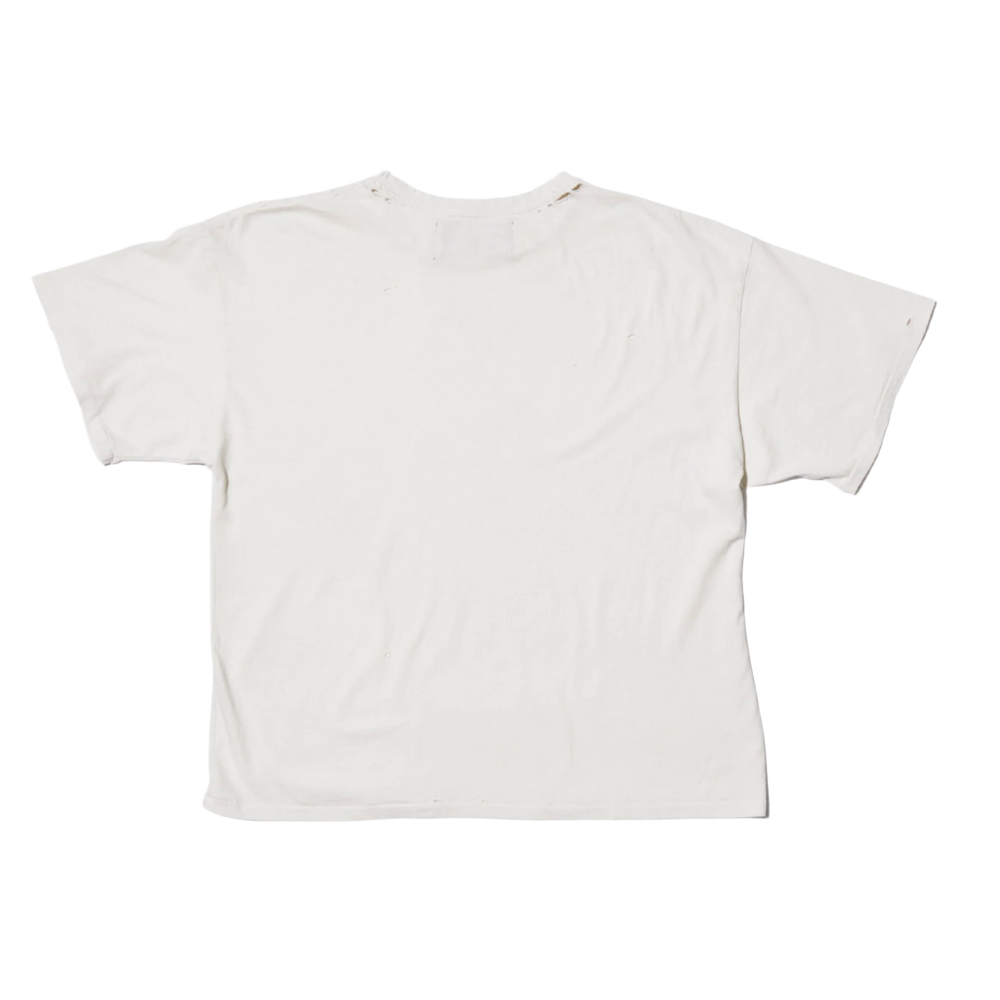 Back flat lay view of the ivory off-white Paly Hollywood t-shirt, highlighting the premium mid-weight cotton fabric structure draping smoothly across a loose fit, featuring seamless upper shoulders and a clean, unadorned solid cream reverse profile stretching down to the straight double-stitched lower hemline.