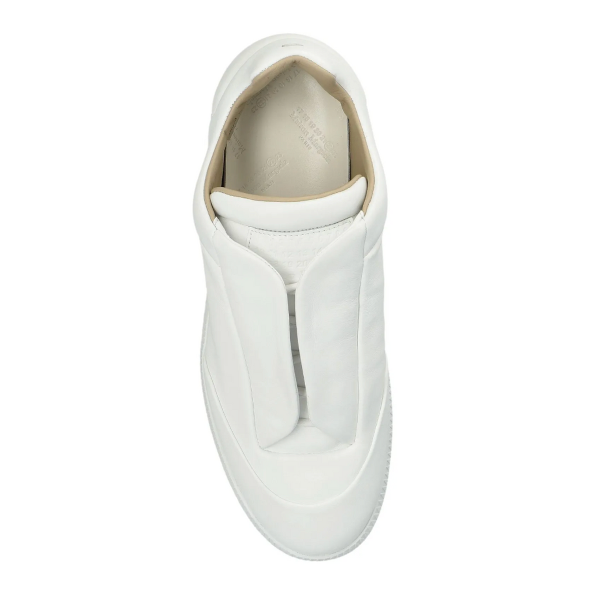 A straight top-down view looking directly into a single white Maison Margiela Future Low sneaker, highlighting the clean hidden-lace configuration, a premium padded white leather interior collar lining, contoured leather insoles, and the brand's iconic minimalist design footprint.