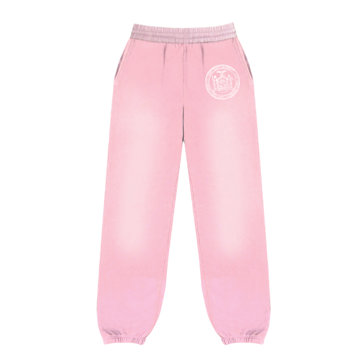 Front flat lay view of the Saint Vanity women's collegiate sweatpants in a soft pastel pink cotton fleece, showcasing a relaxed taper silhouette with gathered elastic ankle cuffs, a thick ruched elastic waistband with a matching tonal drawstring, and a circular white collegiate emblem graphic printed subtly on the upper left thigh.