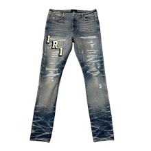 Amiri 'Varsity' Distressed Blue Jeans