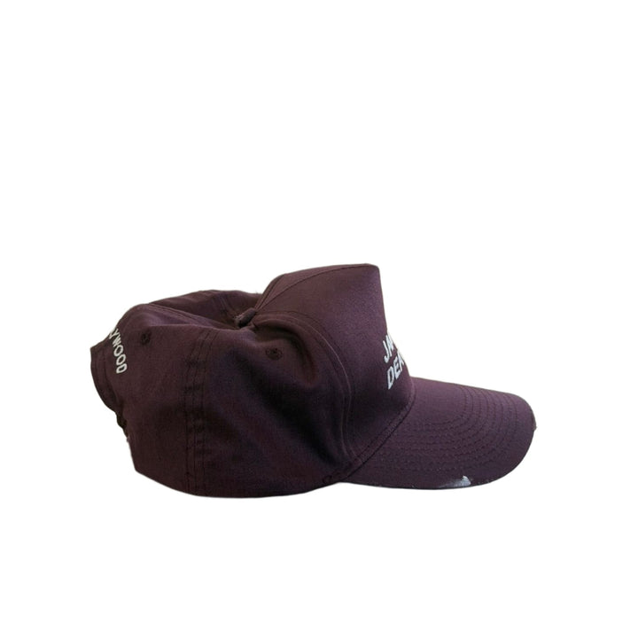 A clean left-side profile view of the Paly Hollywood cap, highlighting the vintage sun-faded fabric texture across the side panels and the uniform contour of the bill against a white background.