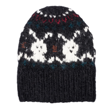 A clean profile layout view of the dark navy Paly hand-knitted beanie resting upright, highlighting the thick density of the chunky multi-colored knit yarn panels, the structural symmetry of the fold-over black ribbed cuff, and the snug watch-cap skull crown silhouette designed for a secure streetwear fit.