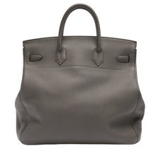 Back view of the Hermès Birkin 40 travel bag in Etoupe Togo leather, emphasizing the sprawling, premium pebbled surface texture across the single-panel back construction and the precise, reinforced hand-stitching securing the bases of the rear leather handles.