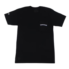 Front flat lay view of the Chrome Hearts t-shirt in a premium heavyweight jet-black cotton jersey, showcasing a relaxed boxy streetwear silhouette, a thick ribbed crewneck collar, seamless shoulders, and a clean minimalist pocket on the left chest accented by a small white signature scroll logo graphic printed across the upper trim pocket line.
