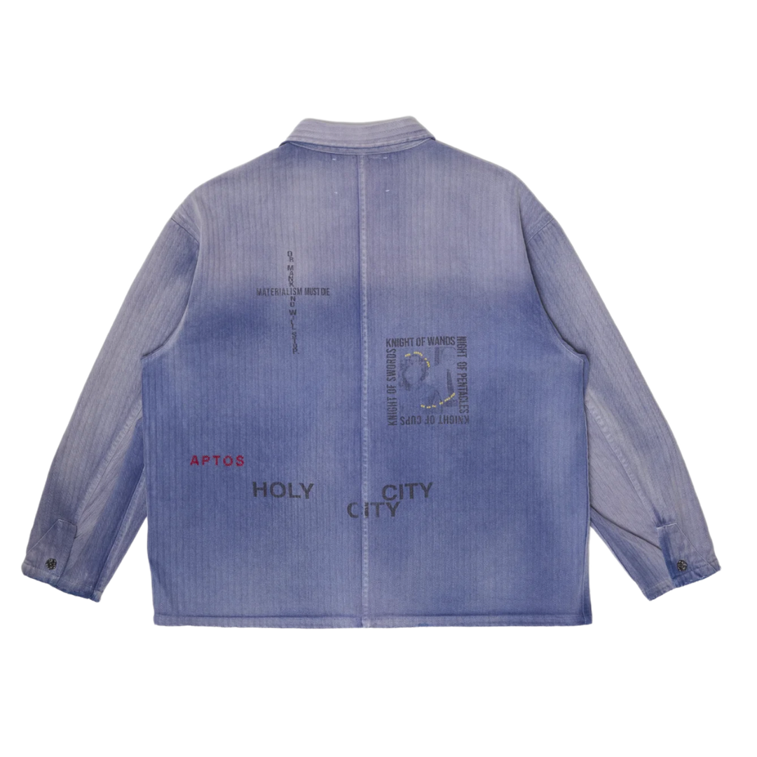 Back flat lay view of the Paly 'Holy City' Work Shirt, highlighting stenciled graphic text including 'APTOS', 'HOLY CITY', 'MATERIALISM MUST DIE', and tarot card names like 'KNIGHT OF WANDS'.