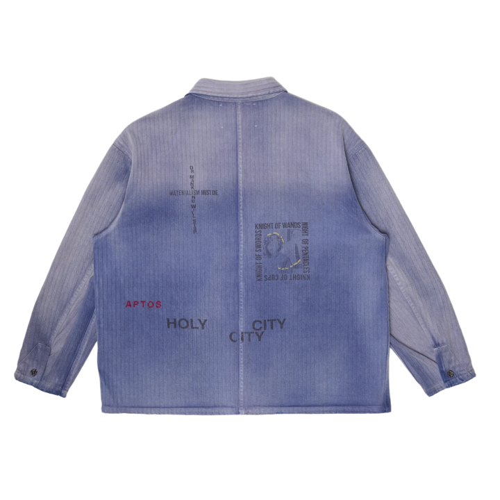 Back flat lay view of the Paly 'Holy City' Work Shirt, highlighting stenciled graphic text including 'APTOS', 'HOLY CITY', 'MATERIALISM MUST DIE', and tarot card names like 'KNIGHT OF WANDS'.