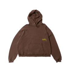 Front flat lay view of the Paly pullover hoodie in a premium heavyweight vintage-washed chocolate brown cotton fleece, showcasing a relaxed boxy streetwear silhouette, a structured drawstringless crossover hood, dropped shoulder seams, a roomy front kangaroo pouch pocket, thick elasticated ribbed knit cuffs and hemline, and a small minimalist yellow embroidered cursive or script logo accent stitched on the center chest.
