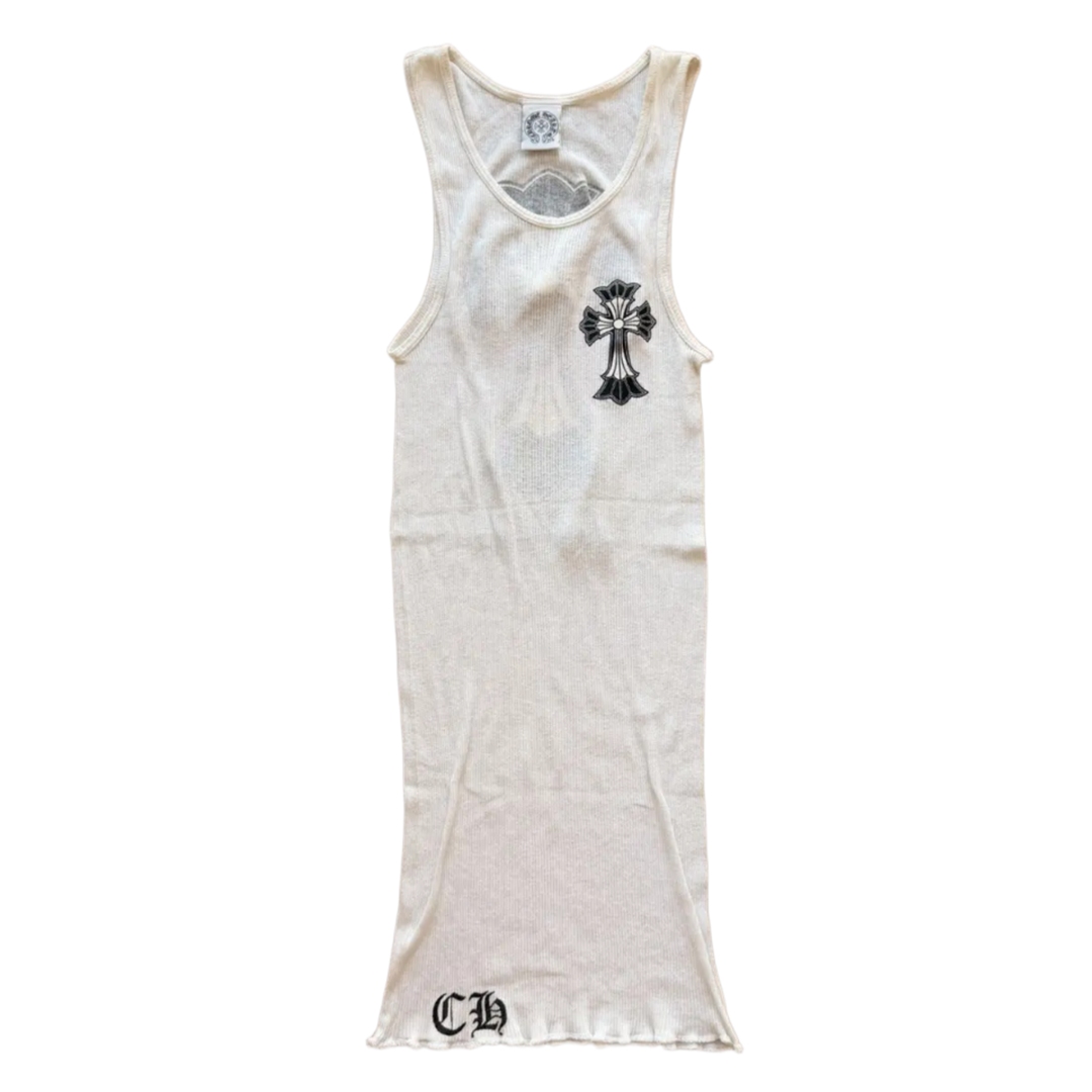 Front flat lay view of the vintage Chrome Hearts tank top in a premium fine-ribbed stark white cotton stretch knit, showcasing an elongated slim-fitting silhouette, a classic deep scoop neckline, an internal brand label at the collar neck, a prominent black gothic cross graphic screen-printed on the left chest, and a bold black gothic 'CH' script monogram logo detailed on the lower right front hemline.