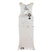 Front flat lay view of the vintage Chrome Hearts tank top in a premium fine-ribbed stark white cotton stretch knit, showcasing an elongated slim-fitting silhouette, a classic deep scoop neckline, an internal brand label at the collar neck, a prominent black gothic cross graphic screen-printed on the left chest, and a bold black gothic 'CH' script monogram logo detailed on the lower right front hemline.