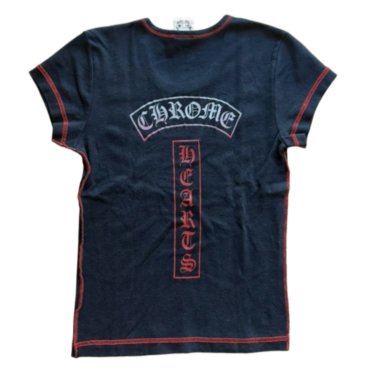 Back flat lay view of the washed black vintage Chrome Hearts baby tee, highlighting the classic racerback or narrow T-bar shoulder construction framed by contrast red flatlock stitching, dominated by an arched blue and white signature gothic text logo across the upper blades and a large vertical red box panel screen-printed down the spine featuring intricate vine dagger graphics.