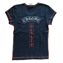 Back flat lay view of the washed black vintage Chrome Hearts baby tee, highlighting the classic racerback or narrow T-bar shoulder construction framed by contrast red flatlock stitching, dominated by an arched blue and white signature gothic text logo across the upper blades and a large vertical red box panel screen-printed down the spine featuring intricate vine dagger graphics.