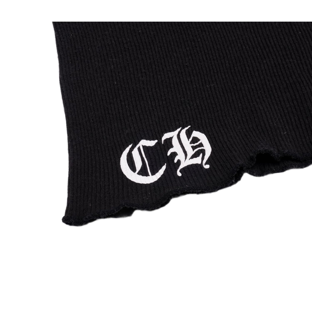 Close-up detail of the lower front hem, showcasing the sharp white embroidery of the stylized gothic 'CH' monogram against the black ribbed trim.