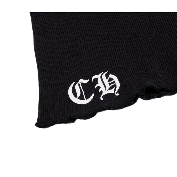 Close-up detail of the lower front hem, showcasing the sharp white embroidery of the stylized gothic 'CH' monogram against the black ribbed trim.
