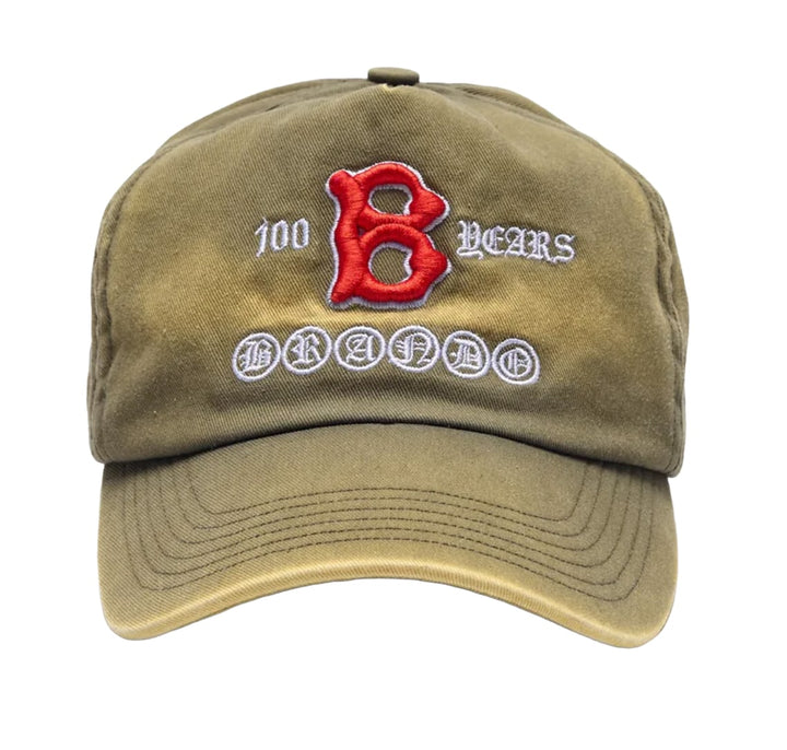 Front view of the Paly 'Brando Hundo' cap in a sun-faded olive khaki cotton canvas, featuring a large collegiate-style red embroidered 'B' with white backing, framed by cream-colored lettering that reads '100 BEARS' and 'BRANDO' enclosed in individual circular patches.