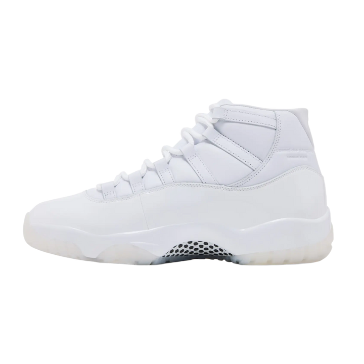 A clean lateral profile view of the all-white Jordan 11 x CDG sneaker, showcasing the high-cut patent leather mudguard wrapped cleanly around the midsole, tonal white lacing loops, and a milky semi-translucent outsole accent under the toe.