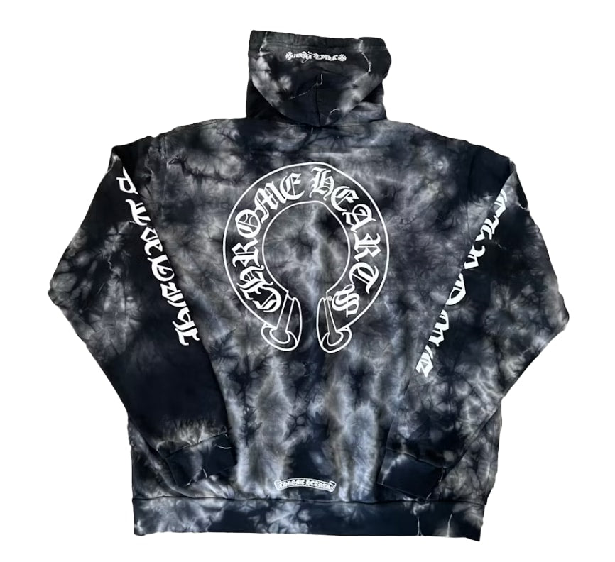 Back flat lay view of the tie-dye Chrome Hearts fleece hoodie, highlighting the relaxed boxy streetwear drape, matching cloud-like abstract grey bleach patterns running uniformly across the back panel, and a massive circular white signature horseshoe logo graphic printed boldly across the center back torso.