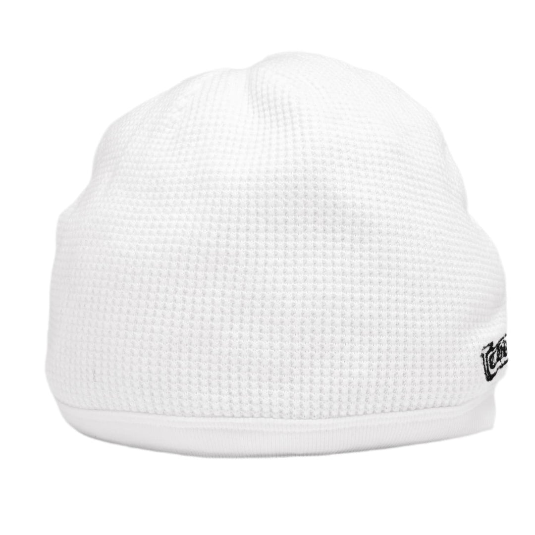 Back view of the white Chrome Hearts thermal skull cap, displaying a small black gothic emblem printed near the lower right edge of the clean, unadorned white waffle panels.