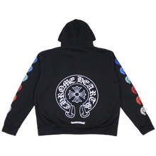Back flat lay view of the black Chrome Hearts hoodie, highlighting the street style drape with a large central multicolor gradient signature horseshoe logo printed across the upper back, beautifully displaying a blending color transition from neon blue to bright purple and green around the central cross motif.