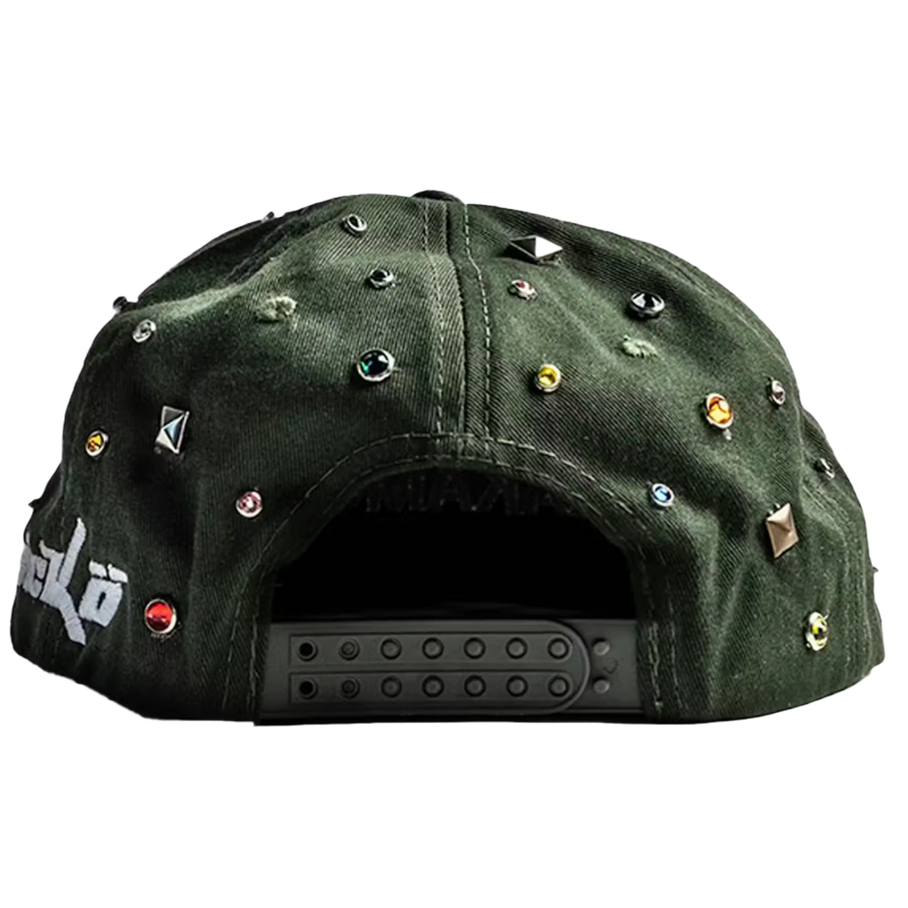 An angled rear view of the green camouflage Satoshi Nakamoto x Sicko studded hat resting flat, highlighting the curved crown architecture, tonal ventilation eyelets, and the adjustable dark green multi-notch plastic snapback enclosure for a customizable fit, accented by a continuation of the scattered silver metallic stud clusters running across the side and rear panel walls.