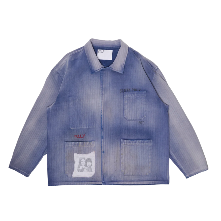 Front flat lay view of the Paly 'Holy City' Work Shirt in a faded purple-blue wash with vertical striping, featuring three large patch pockets, red 'PALY' embroidery, and a graphic patch on the bottom left.