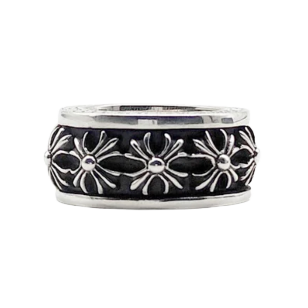 A side view of the wide Chrome Hearts sterling silver spinner ring resting flat, highlighting the central rotating band carved with a repeating pattern of raised, highly detailed gothic plus cross motifs separated by dark oxidization accents.