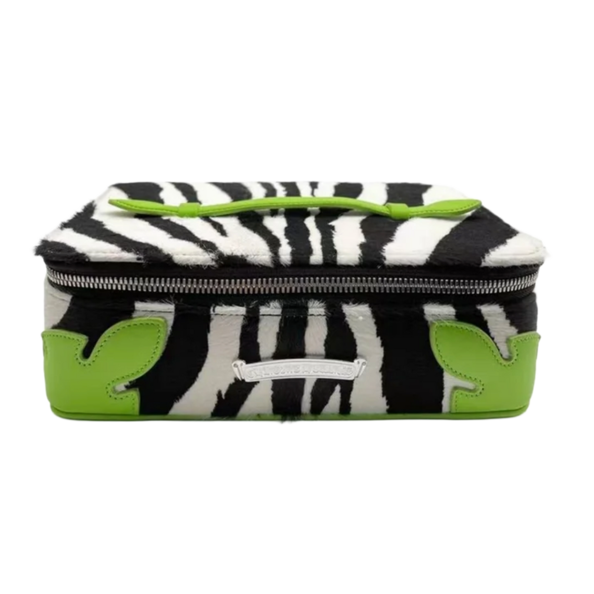 Front view of the Chrome Hearts jewelry case in an exotic neon green and black zebra-striped patterned leather, showcasing a rectangular structured hardcase silhouette, dual matching rolled leather grab handles on the lid, and a heavy wrap-around zipper closure system adorned with a large, polished sterling silver signature dagger pull.