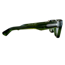 A right-side profile view of the Chrome Hearts glasses, focusing on the heavy translucent green acetate temple arm adorned with detailed sterling silver scroll metalwork detailing at the front hinge.