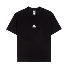 Front flat lay view of a Nike ACG short-sleeve t-shirt in solid black cotton, featuring a small white embroidered classic ACG triangle logo centered on the upper chest below the crew neckline.