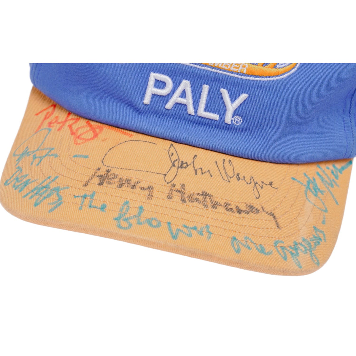 An angled close-up view of the cap, showcasing a custom blue rectangular vintage-style fabric patch with an embroidered red 'PALY' logo stitched onto the side panel near the brim.