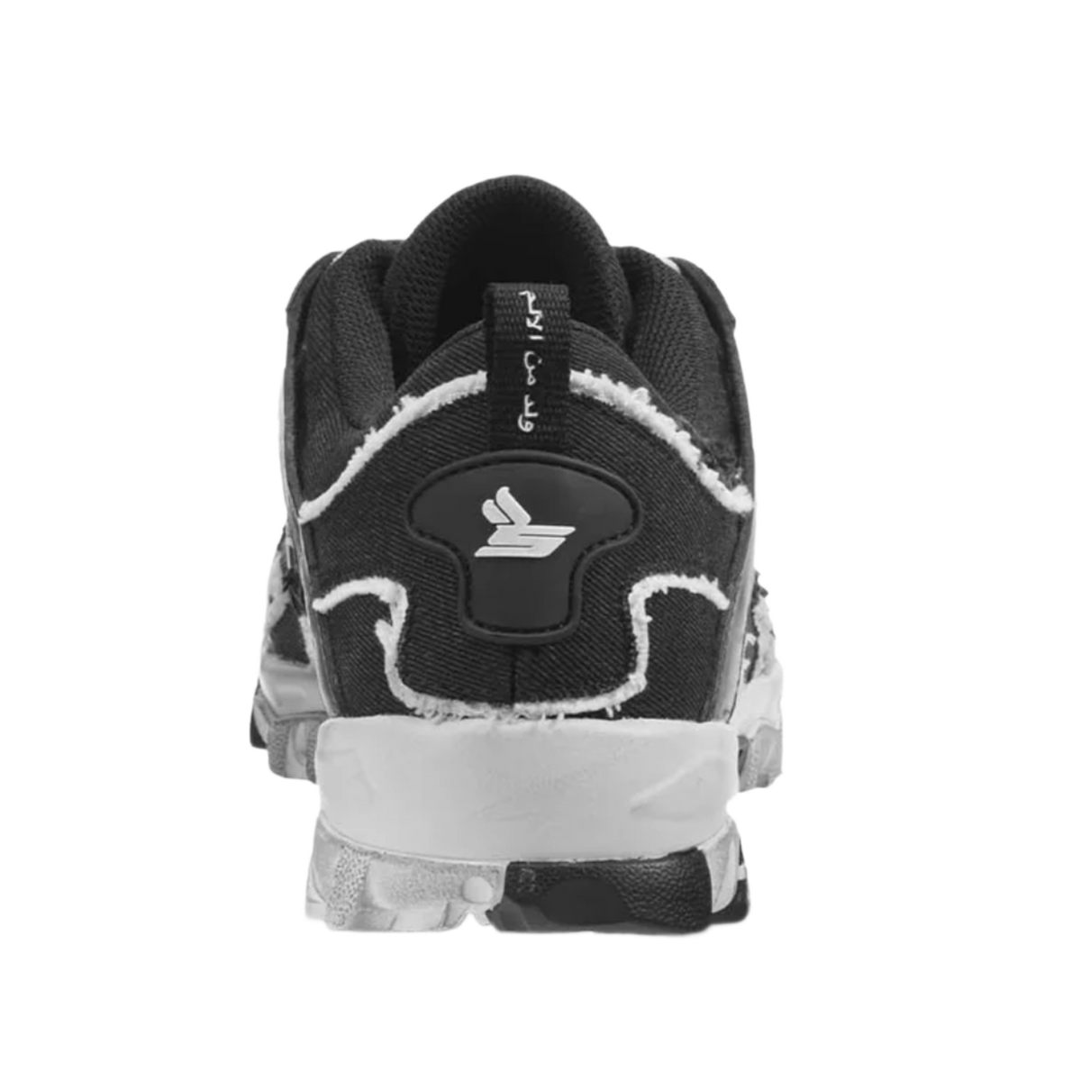 A straight-on rear view of the black and white Sicko Vessel shoe, highlighting the layered technical paneling along the heel counter, sharp contrast white wave patterns wrapping around the lower heel cup, a centered vertical canvas pull loop, and the thick, protective lugged stance of the dual-colored high-traction rubber outsole.