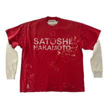 Front flat lay view of the Satoshi Nakamoto 'Luke' long-sleeve top, showcasing a unique double-layer design featuring a distressed short-sleeve red graphic t-shirt layered over cream-colored waffle-knit thermal long sleeves, detailed with bold white printed branding reading 'SATOSHI NAKAMOTO' across the chest, heavy contrast white stitching, and a vintage-washed bleached paint pattern along the lower torso.