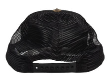 A straight-on rear view of the black Chrome Hearts trucker cap, showcasing the curved, airy black mesh backing panels, an adjustable multi-notch plastic snapback enclosure for a customizable fit, and an open lower rear cutout revealing the clean structure of the interior crown support walls.