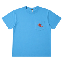 Front flat lay view of the Matty Boy Anti Promo short-sleeve t-shirt in vibrant blue cotton, featuring a classic crew neck, a single patch pocket on the left chest, and a small red hand-drawn cartoon character graphic peeking over the top of the pocket.