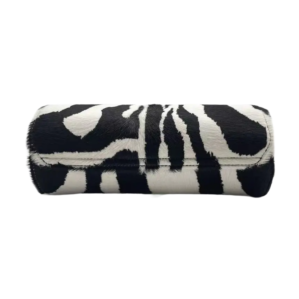 An angled side-profile view of the closed 'Green Zebra' leather watch roll resting horizontally, showcasing the continuous flow of the vibrant neon green and black zebra pattern across the curved leather paneling, immaculate black perimeter edge glazing, and tight structural stitching.