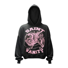 Front flat lay view of the Saint Vanity 'Griffin' hoodie in heavyweight jet-black cotton fleece, showcasing an oversized boxy silhouette with dropped shoulders, tight ribbed cuffs and hem, a structured crossover drawstringless hood, a large kangaroo pouch pocket, and a bold circular chest graphic featuring a detailed pink illustrated griffin mythical creature flanked by bold arched text reading 'SAINT' above and 'VANITY' below.