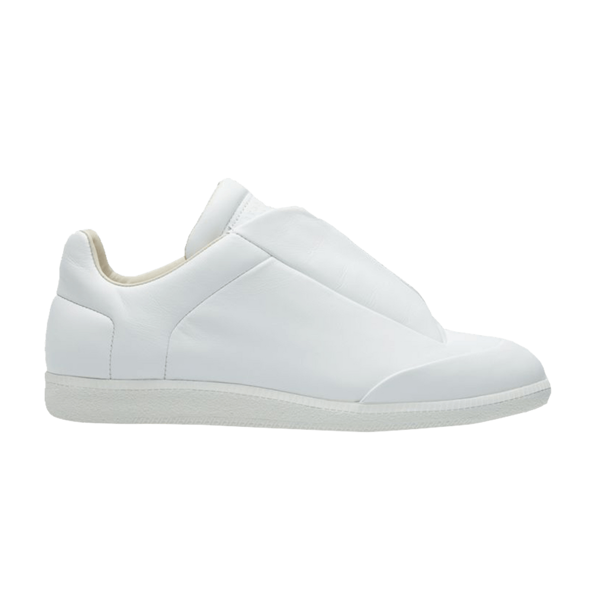 A lateral side profile view of the Maison Margiela Future Low sneaker, showcasing a sleek, minimalist low-top silhouette crafted from a premium matte white full-grain leather upper, featuring a hidden lacing structure completely concealed beneath smooth leather lace-covering shroud flaps, deep architectural vertical side-panel slits, and a matching textured white rubber sole unit.