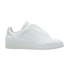 A lateral side profile view of the Maison Margiela Future Low sneaker, showcasing a sleek, minimalist low-top silhouette crafted from a premium matte white full-grain leather upper, featuring a hidden lacing structure completely concealed beneath smooth leather lace-covering shroud flaps, deep architectural vertical side-panel slits, and a matching textured white rubber sole unit.