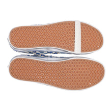 A bottom view showcasing the underside of both sneakers, displaying the signature Vans gum rubber waffle tread pattern outsoles with a clean, flat perimeter wrap finish.