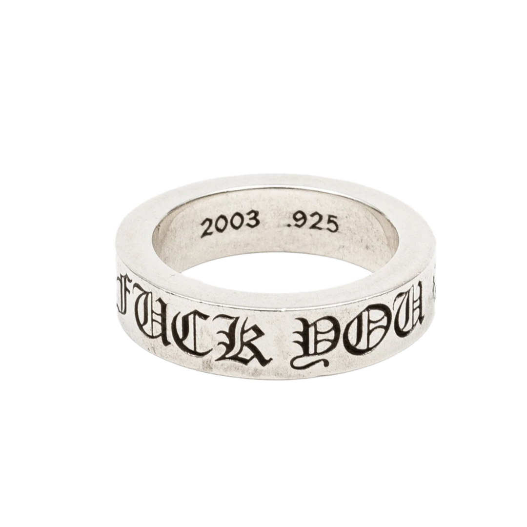 A slightly angled side view of the 6mm Chrome Hearts sterling silver spacer ring, showcasing bold gothic lettering reading 'FUCK YOU' engraved across the outer band, with the top edge clearly displaying a stamped '2003' copyright year and '.925' silver purity hallmark.