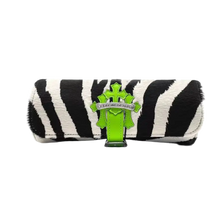 Front view of the Chrome Hearts watch roll encased in exotic neon green and black zebra-striped pattern leather, featuring a cylindrical structural travel design secured by an integrated green leather strap that fastens at the center with a polished sterling silver signature floral cross snap button.