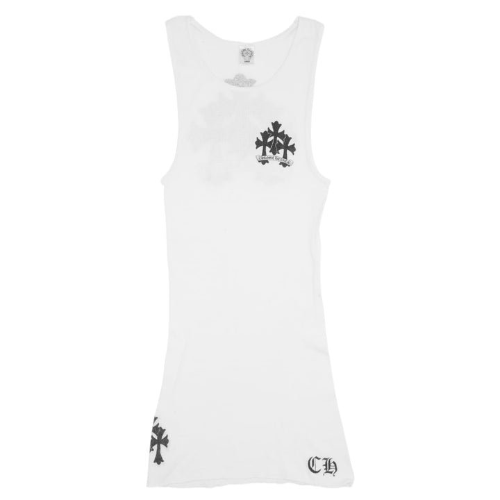 Front flat lay view of a Chrome Hearts vintage tank top in white ribbed cotton, featuring a small black floral cross print on the left ribs, a single cross on the lower left hem, and a black gothic 'CH' logo embroidered on the bottom right.